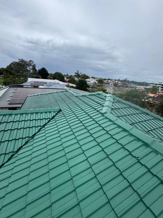 A green tile roof seen from the ridge